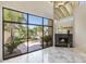 Bright living room with fireplace and view of backyard at 4710 N 65Th St, Scottsdale, AZ 85251