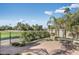 Inviting patio with seating area, lush landscaping, and golf course views at 4710 N 65Th St, Scottsdale, AZ 85251