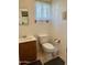 Simple bathroom with a toilet and sink at 7750 E Broadway Rd # 348, Mesa, AZ 85208