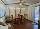 Light and airy dining area with wood table and chairs, and access to the outdoors at 7750 E Broadway Rd # 348, Mesa, AZ 85208