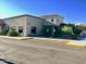 Single-story stucco building with parking lot and landscaping at 7750 E Broadway Rd # 348, Mesa, AZ 85208