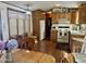 Bright kitchen with wood cabinets, laminate flooring, and a dining area at 7750 E Broadway Rd # 348, Mesa, AZ 85208