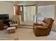 Living room with two armchairs and access to exterior at 7750 E Broadway Rd # 348, Mesa, AZ 85208