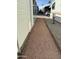 A gravel walkway between houses at 7750 E Broadway Rd # 348, Mesa, AZ 85208
