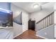 Entryway with large fish tank and staircase at 888 W Aspen Way, Gilbert, AZ 85233