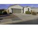 Single-story house with a two-car garage and driveway at 970 W Lincoln Ave, Coolidge, AZ 85128