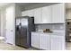 Modern kitchen with white cabinets and stainless steel appliances at 970 W Lincoln Ave, Coolidge, AZ 85128