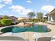 Inviting backyard oasis featuring a large pool and spa at 16907 W Greenbriar Point Ct, Surprise, AZ 85387