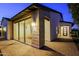 View of the home's entryway with stone accents and paved walkway at 17888 E Vista Desierto --, Rio Verde, AZ 85263