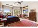 Relaxing main bedroom with access to patio and built-in entertainment center at 18626 E Picacho Rd, Rio Verde, AZ 85263