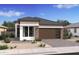 One-story home with brown garage door and stone accents at 20305 W Turney Ave, Buckeye, AZ 85396