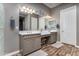 Double vanity bathroom with a glass block shower at 21915 E Silver Creek Ct, Queen Creek, AZ 85142