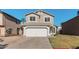 Two-story house with a white garage door and well-maintained lawn at 3134 E Mckellips Rd # 207, Mesa, AZ 85213