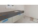 Modern bathroom with gray tile and floating vanity at 37200 N Cave Creek Rd # 1023, Scottsdale, AZ 85262