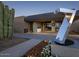 Luxury community entrance with modern architecture and landscaping at 37200 N Cave Creek Rd # 1023, Scottsdale, AZ 85262