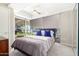 Cozy bedroom with a queen-size bed and plenty of natural light at 7137 E Rancho Vista Dr # 2002, Scottsdale, AZ 85251