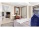 Bright bedroom with plush bedding and view into living area at 7137 E Rancho Vista Dr # 2002, Scottsdale, AZ 85251