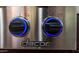 Close-up of a modern gas cooktop with blue LED lights at 7137 E Rancho Vista Dr # 2002, Scottsdale, AZ 85251