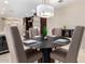Elegant dining area with a dark wood table and four chairs at 7137 E Rancho Vista Dr # 2002, Scottsdale, AZ 85251