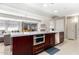 Large kitchen island with a built-in microwave and ample counter space at 7137 E Rancho Vista Dr # 2002, Scottsdale, AZ 85251