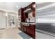 Modern kitchen with stainless steel appliances and dark wood cabinetry at 7137 E Rancho Vista Dr # 2002, Scottsdale, AZ 85251