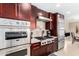Modern kitchen with stainless steel appliances and dark wood cabinets at 7137 E Rancho Vista Dr # 2002, Scottsdale, AZ 85251