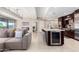 Modern kitchen with island, wine cooler, and living room access at 7137 E Rancho Vista Dr # 2002, Scottsdale, AZ 85251
