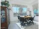 Bright dining area with a round table and pool view at 7387 W Cactus Wren W Way, Florence, AZ 85132