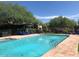 Inviting community pool with plenty of lounge chairs at 7552 E Whisper Rock Trl, Scottsdale, AZ 85266