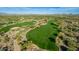 Aerial view of a lush golf course with desert surroundings at 7552 E Whisper Rock Trl, Scottsdale, AZ 85266