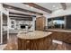 Open concept kitchen with curved island and breakfast bar at 7552 E Whisper Rock Trl, Scottsdale, AZ 85266