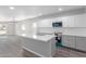 Modern kitchen with white and gray cabinets and quartz countertops at 9195 N Diffin Rd, Florence, AZ 85132