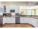 Well-equipped kitchen featuring white cabinets and granite countertops at 12000 N 144Th Way, Scottsdale, AZ 85259