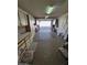 Spacious garage with overhead storage and work bench at 13626 W Aleppo Dr, Sun City West, AZ 85375