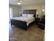 Large main bedroom with a king-size bed and tile floors at 13626 W Aleppo Dr, Sun City West, AZ 85375