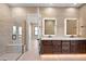 Elegant bathroom with walk-in shower, double vanity, and marble countertops at 14174 E Highland Ave, Fountain Hills, AZ 85268