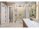 Bathroom with walk-in shower, toilet, and double vanity at 14174 E Highland Ave, Fountain Hills, AZ 85268