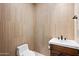 Small powder room with toilet and single vanity at 14174 E Highland Ave, Fountain Hills, AZ 85268