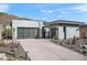 Modern home exterior with sleek design and desert landscaping at 14174 E Highland Ave, Fountain Hills, AZ 85268