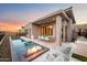 Inviting backyard oasis with a rectangular pool, fire pit, and patio furniture at 14174 E Highland Ave, Fountain Hills, AZ 85268