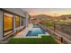 Modern pool and patio design with mountain views and artificial turf at 14174 E Highland Ave, Fountain Hills, AZ 85268