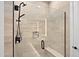 Modern shower with glass enclosure, built-in seat, and rainfall shower head at 14174 E Highland Ave, Fountain Hills, AZ 85268