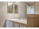 Clean bathroom with double vanity and large mirror at 14950 W Mountain View Blvd # 1310, Surprise, AZ 85374