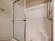 Shower stall with glass enclosure and tiled walls at 14950 W Mountain View Blvd # 1310, Surprise, AZ 85374