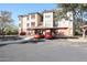 Condo building with parking and landscaping at 14950 W Mountain View Blvd # 1310, Surprise, AZ 85374