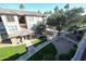 Partial view of the building and surrounding green areas at 14950 W Mountain View Blvd # 1310, Surprise, AZ 85374
