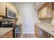 Galley kitchen with stainless steel appliances at 14950 W Mountain View Blvd # 1310, Surprise, AZ 85374