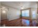 Spacious living room featuring hardwood floors and ceiling fan at 14950 W Mountain View Blvd # 1310, Surprise, AZ 85374