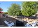 Relaxing backyard with seating area and citrus trees at 15805 W Arrowhead Dr, Surprise, AZ 85374