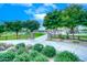 Concrete pathway through a landscaped park area at 17316 W Seldon Ln, Waddell, AZ 85355